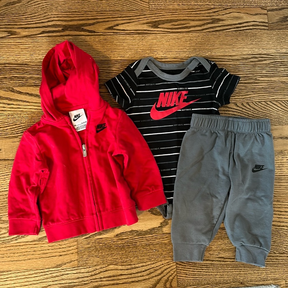 Nike three-piece outfit with pants, short sleeve onesie, and zip up